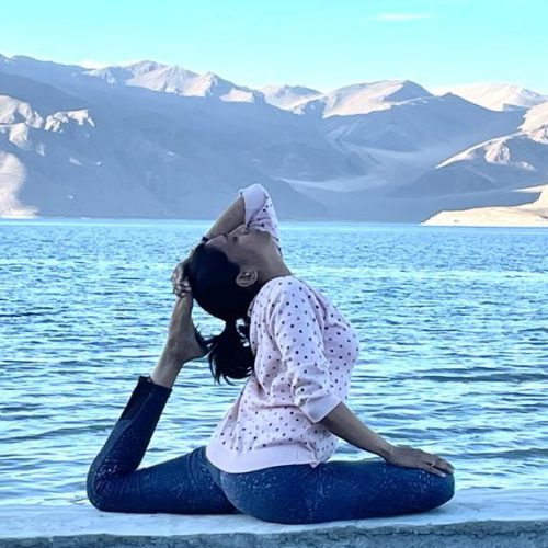Dr. Saraswathi Bukka practising by a mountain lake